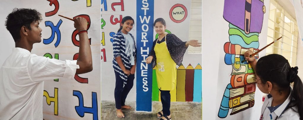 Volunteers painting colorful school wall murals.