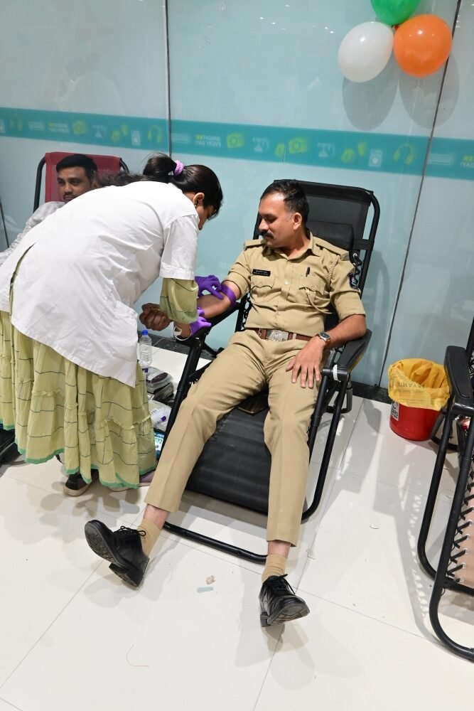 Police officer donating blood